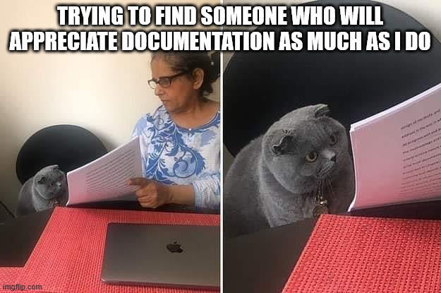 Two images side by side: First image is a woman showing a cat a stack of documents, the second image is the first image zoomed in on the cat and the documents. The text across the top of both images says "Trying to find someone who will appreciate documentation as much as I do." Two images side by side: First image is a woman showing a cat a stack of documents, the second image is the first image zoomed in on the cat and the documents. The text across the top of both images says "Trying to find someone who will appreciate documentation as much as I do."
