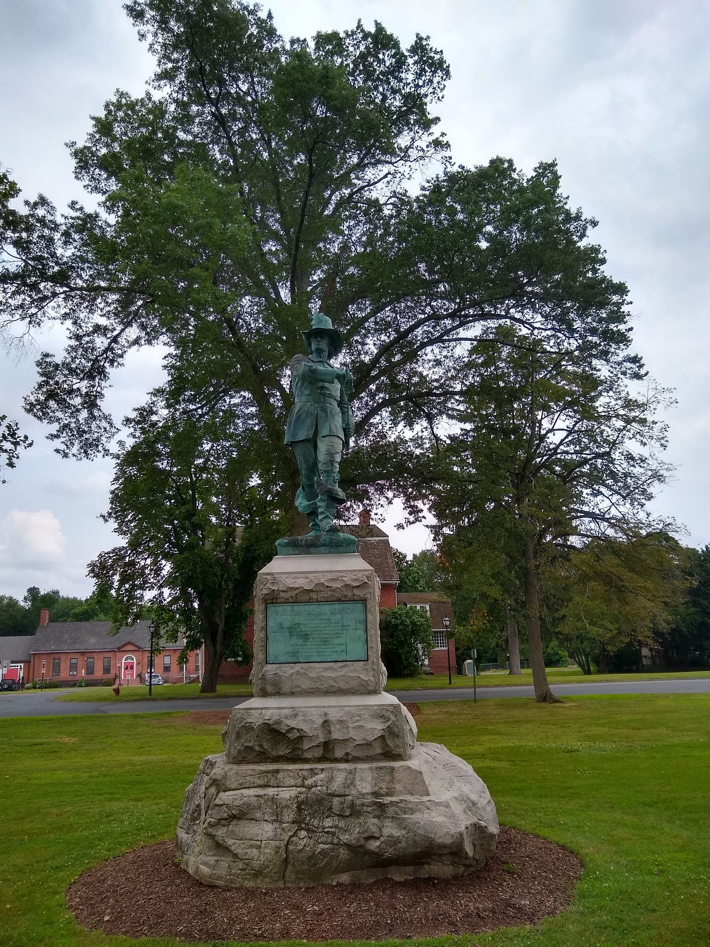 The full size john mason statue on the green before it was moved