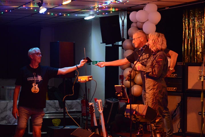 A raffle on stage with a tombola