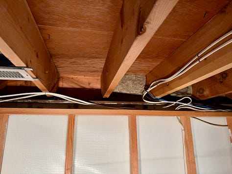 Photo mosaic of fire blocking and insulation being installed in basement walls.