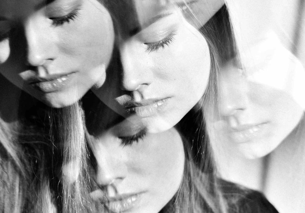 Black and white shadow mirrored images of an Asian girl's face Black and white shadow mirrored images of an Asian girl's face