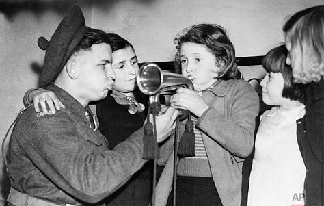 Black and white images of Christmas parties for children during the Second World War