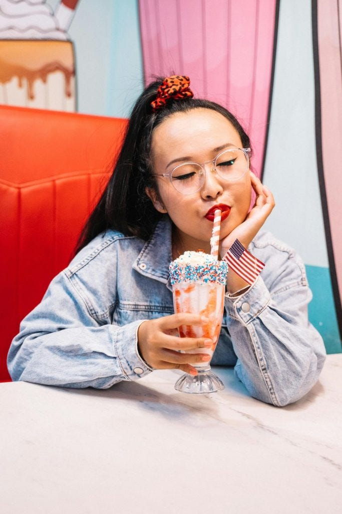 woman enjoying her italian cream soda