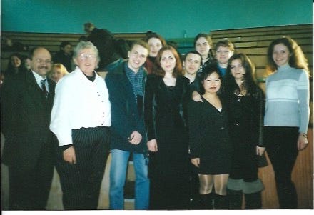 A group of people posing for a photo

AI-generated content may be incorrect.