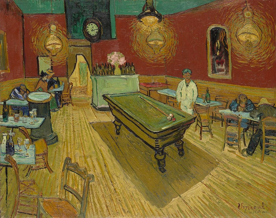 Van Gogh’s the Night Cafe: A dimly lit cafe interior with red walls, a green ceiling, a pool table in the center, a few scattered tables and chairs, and several people sitting or standing around the room. 