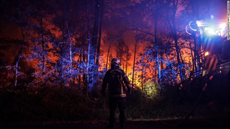 A firefighter pictured next to his vehicle in southwestern France.