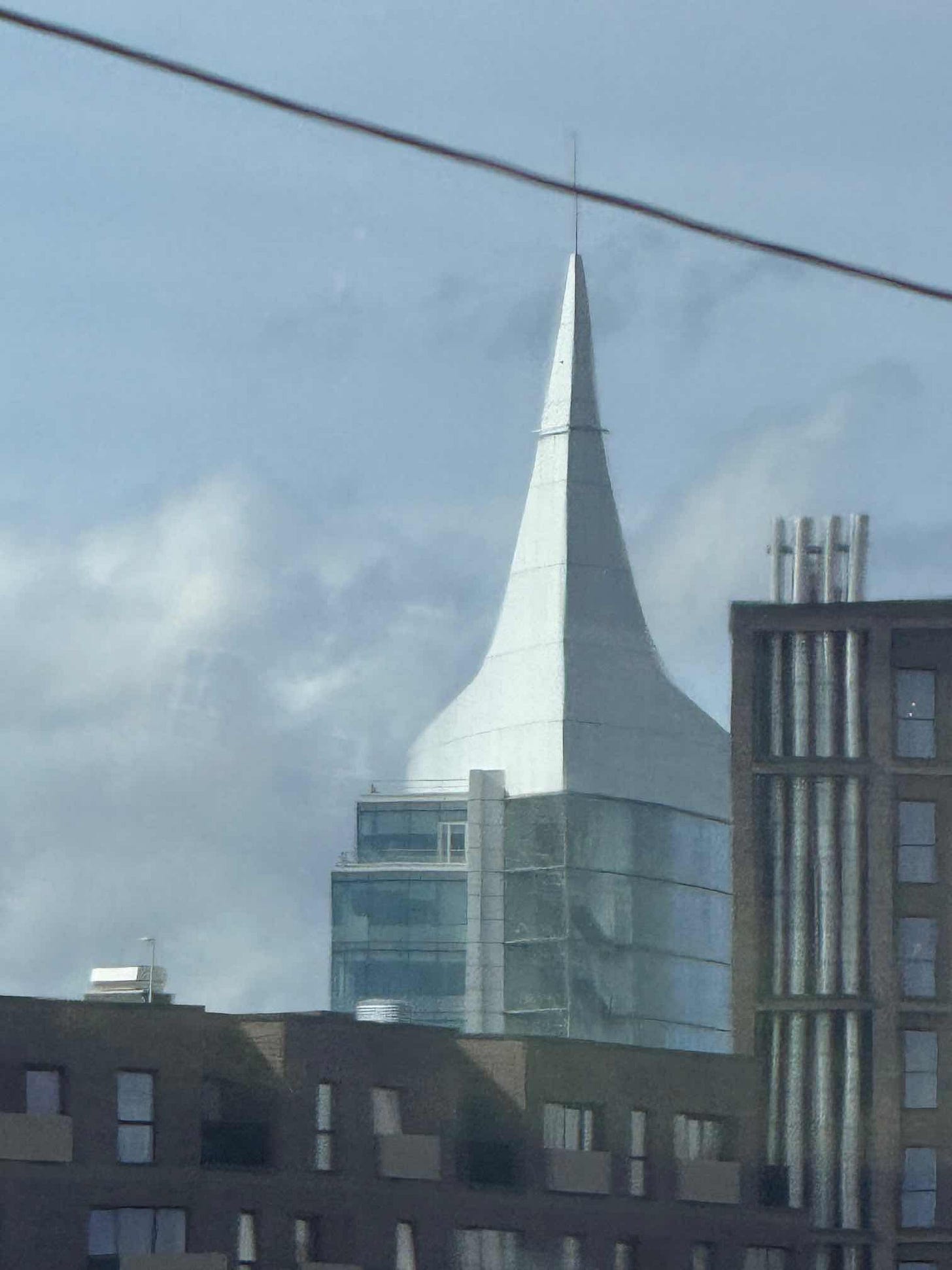not a great photo of a building with a distinctive shaped roof not a great photo of a building with a distinctive shaped roof