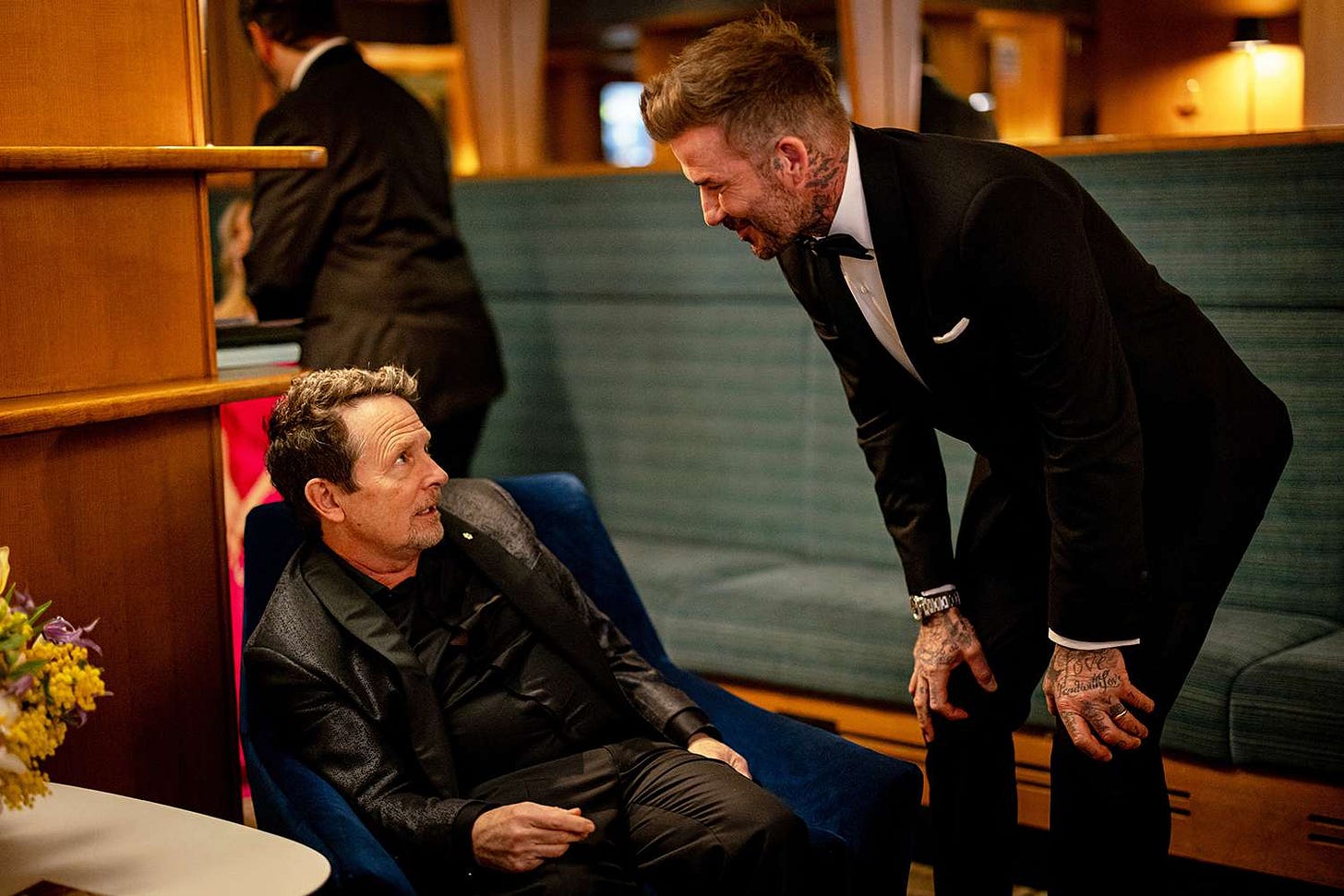Michael J. Fox and David Beckham backstage during the EE BAFTA Film Awards 2024 at The Royal Festival Hall on February 18, 2024 in London, England.