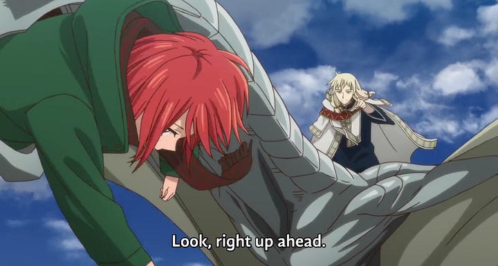 Chise inside a dragon's mouth. The dragon is flying and is being ridden by a blonde haired man. He tells Chise to look up ahead.
