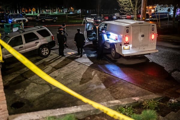 Police officers at the scene of the shooting in Portland on Saturday night.