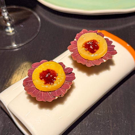 Amuses bouches including poached oysters, puffed bread and goat cheese tartelette at Virtus restaurant, Paris