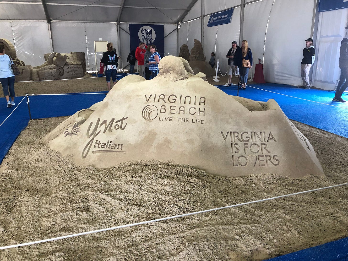 engraved in a mound of sand are: ynot italian, virginia beach: live the life, and viginia is for lovers
