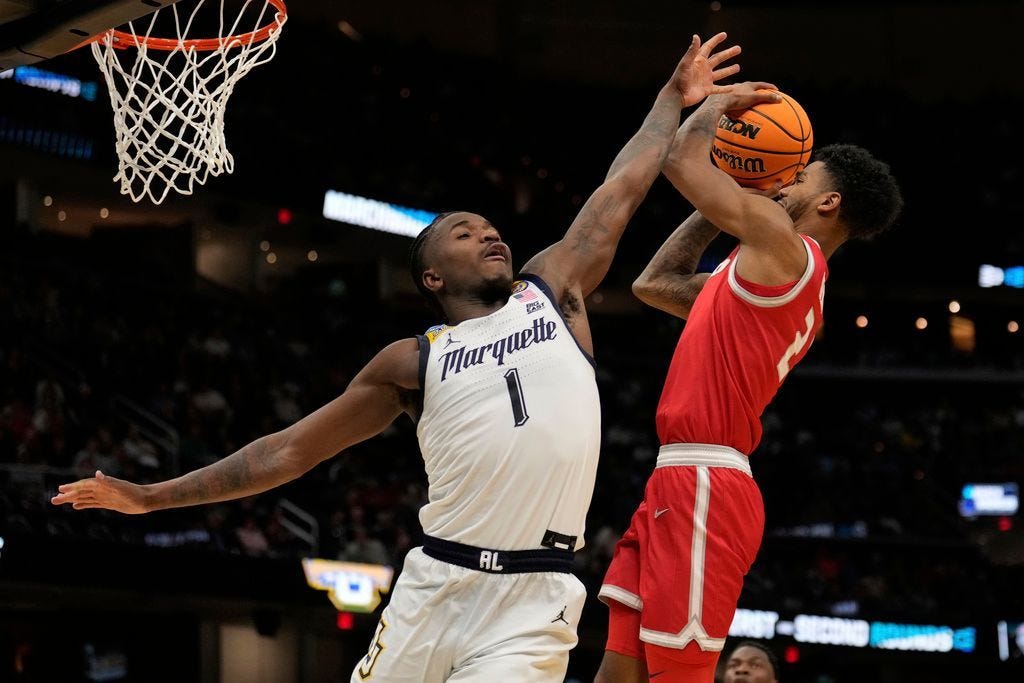 Donovan Dent scores 21 points to lead New Mexico over Marquette 75-66
