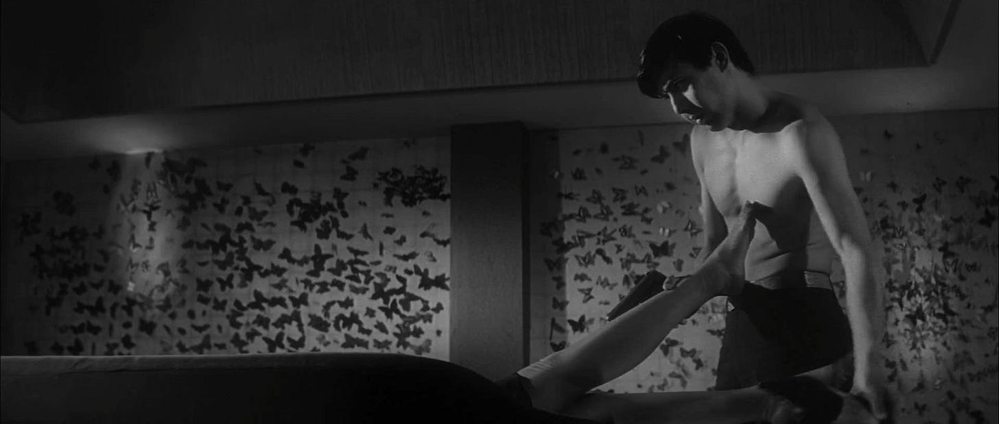 Still from Seijun Suzuki’s “Branded to Kill” (1967) of actor Joe Shishido looking at a woman's f