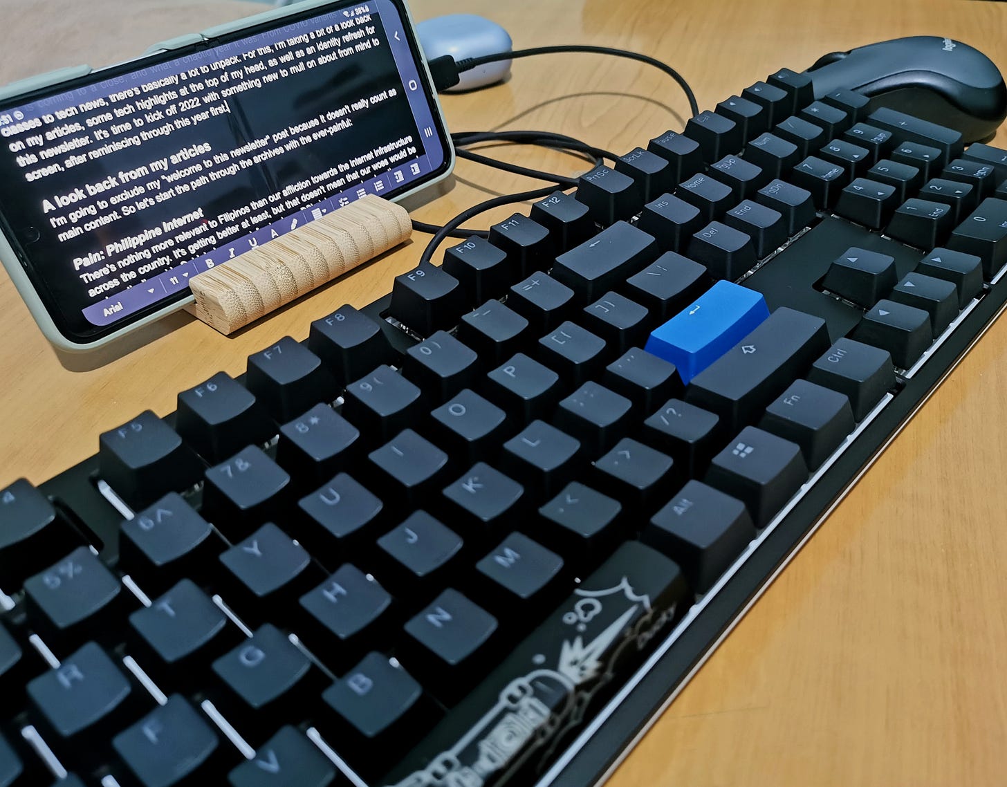 A keyboard connected to a phone for comedic effect.