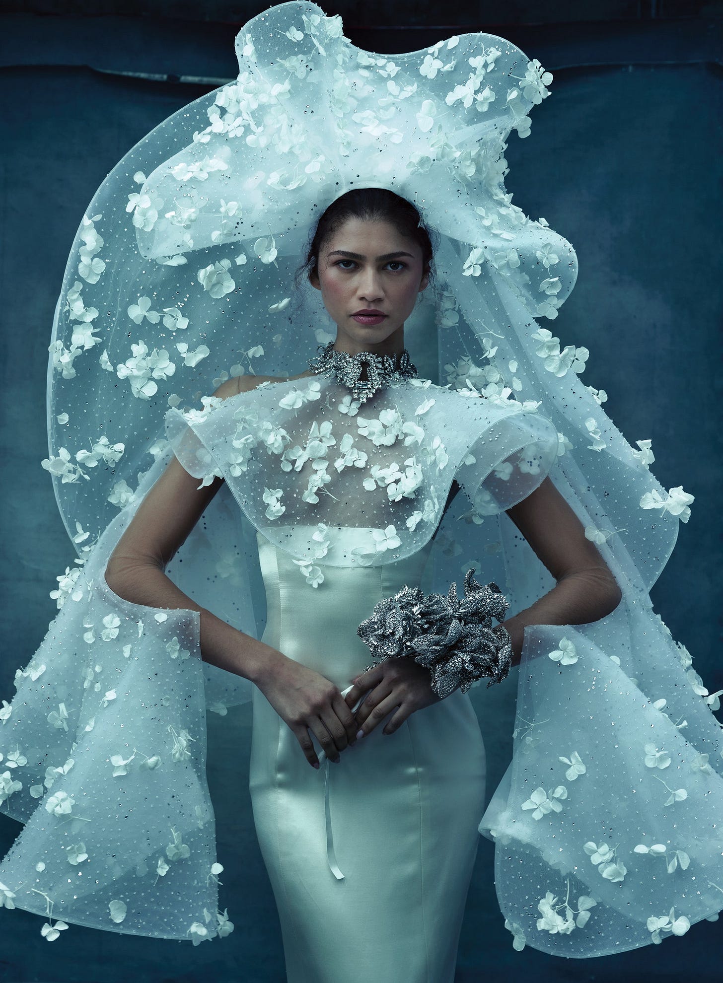 Image may contain Zendaya Clothing Dress Formal Wear Fashion Gown Wedding Wedding Gown Adult and Person