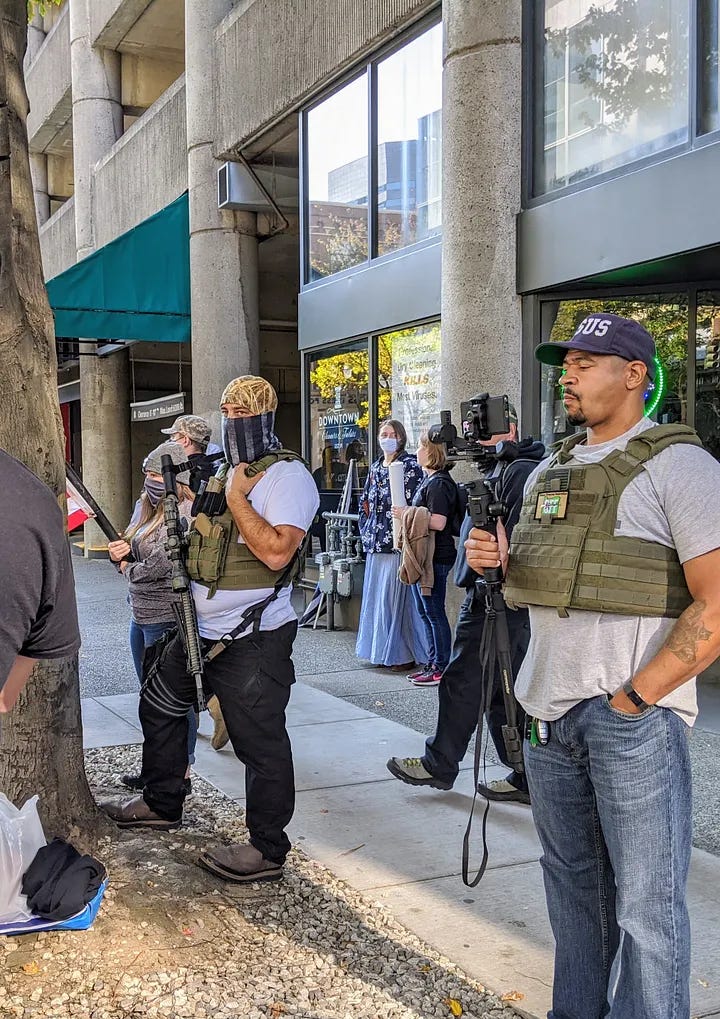 Left: guys in flak vests and an American flag gaitor. One of them is carrying an AR 15. Right: guys in flak vests making an arrest, one with an American Flag neck gaitor