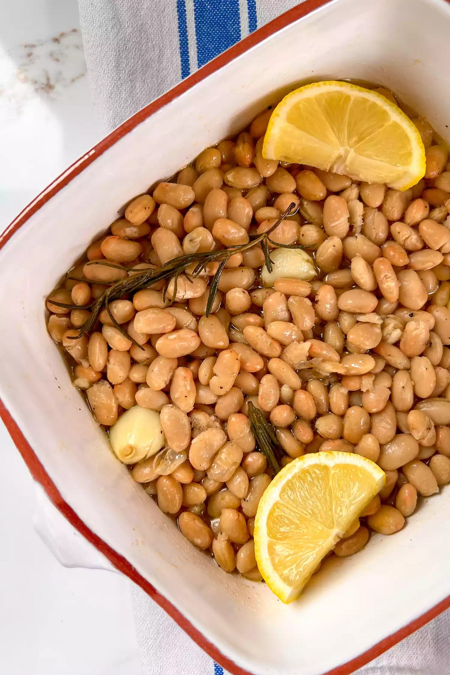 Braised white beans in a casserole dish
