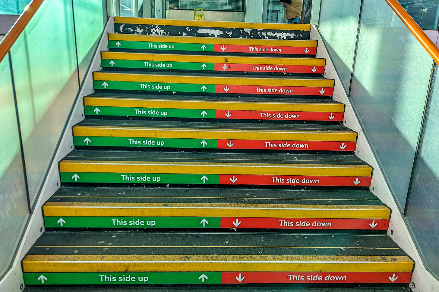Stairs with directional signs.