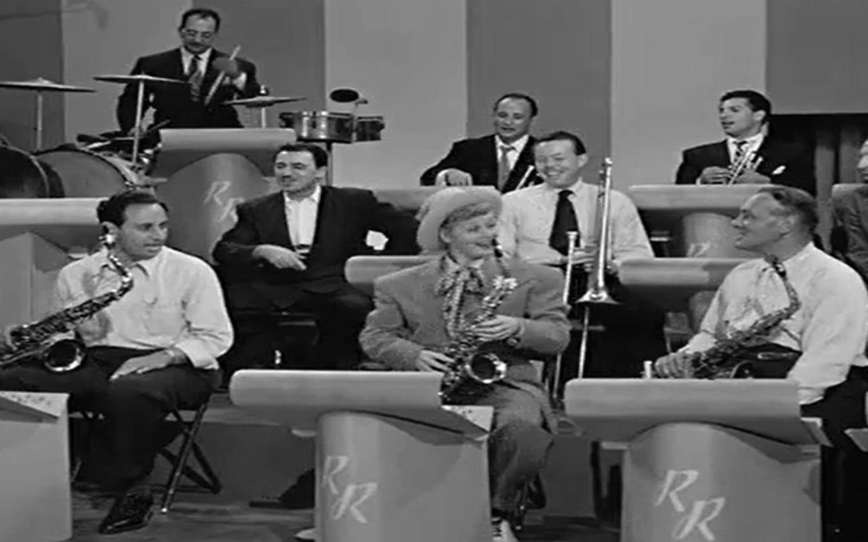 A group of people playing instruments

Description automatically generated