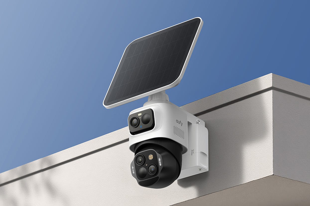The Eufycam S4 attached to a roof line with its included solar panel above it.