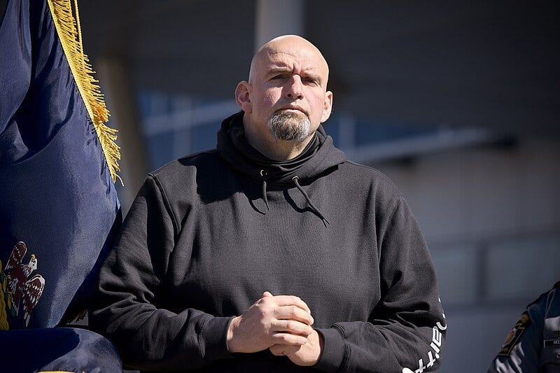 John Fetterman, wearing a black hoodie, when he was Lt. Gov. of Penssylvania in 2022. John Fetterman, wearing a black hoodie, when he was Lt. Gov. of Penssylvania in 2022.