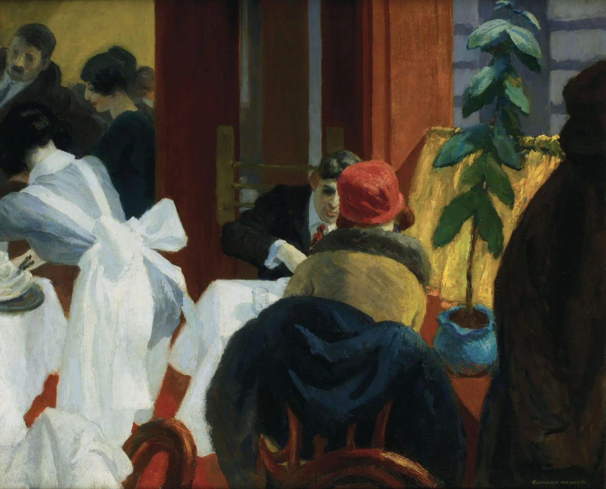 A painting depicting an indoor restaurant scene with people seated at tables covered in white tablecloths. A woman in a red hat faces a man, and a plant sits on a table with a yellow lamp. *New York Restaurant* (1922) by Edward Hopper via [Wikimedia](https://en.wikipedia.org/wiki/Edward_Hopper#/media/File:New_york_restaurant_by_edward_hopper.jpg)