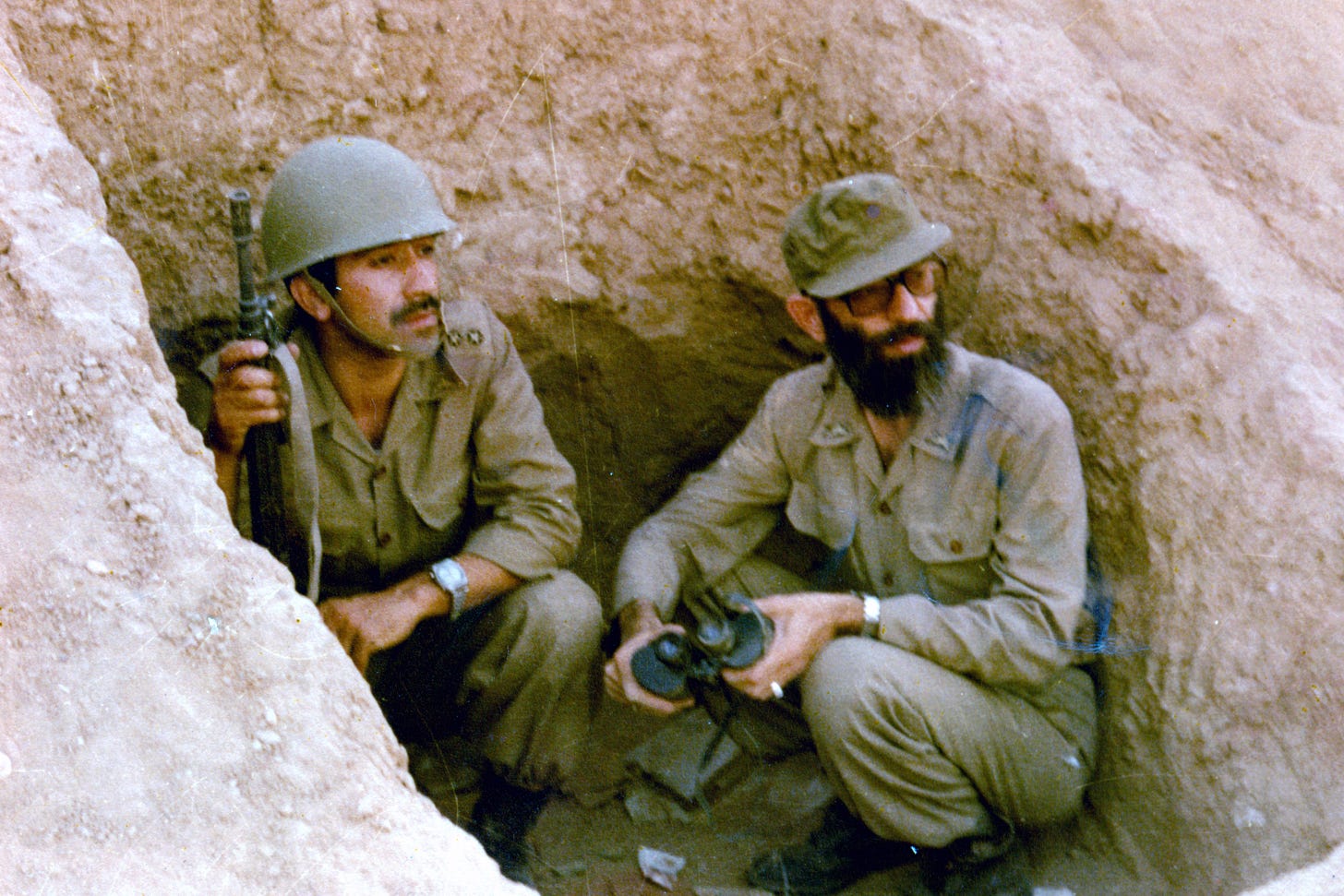 Future Supreme Leader Ali Khamenei, then President, in a trench during the Iran-Iraq War, circa 1980-1988.