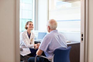 female doctor and elderly man
