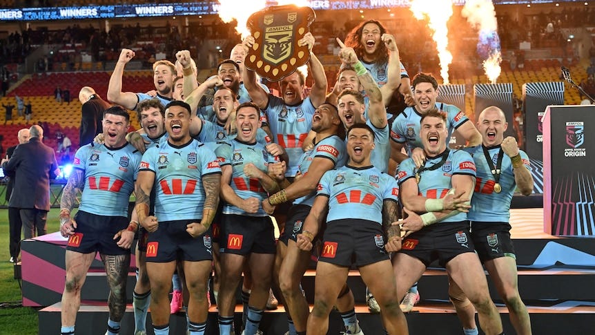 The Blues celebrate with the State of Origin Shield. The Blues celebrate with the State of Origin Shield.