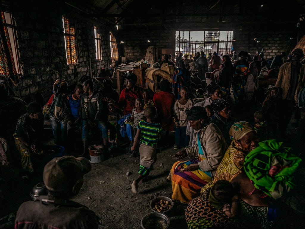 Newly displaced families seeking shelter in a church in Munigi Newly displaced families seeking shelter in a church in Munigi
