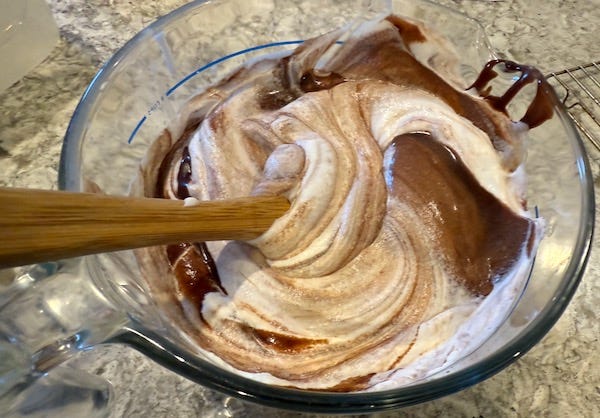 Folding chocolate mixture into the whipped cream