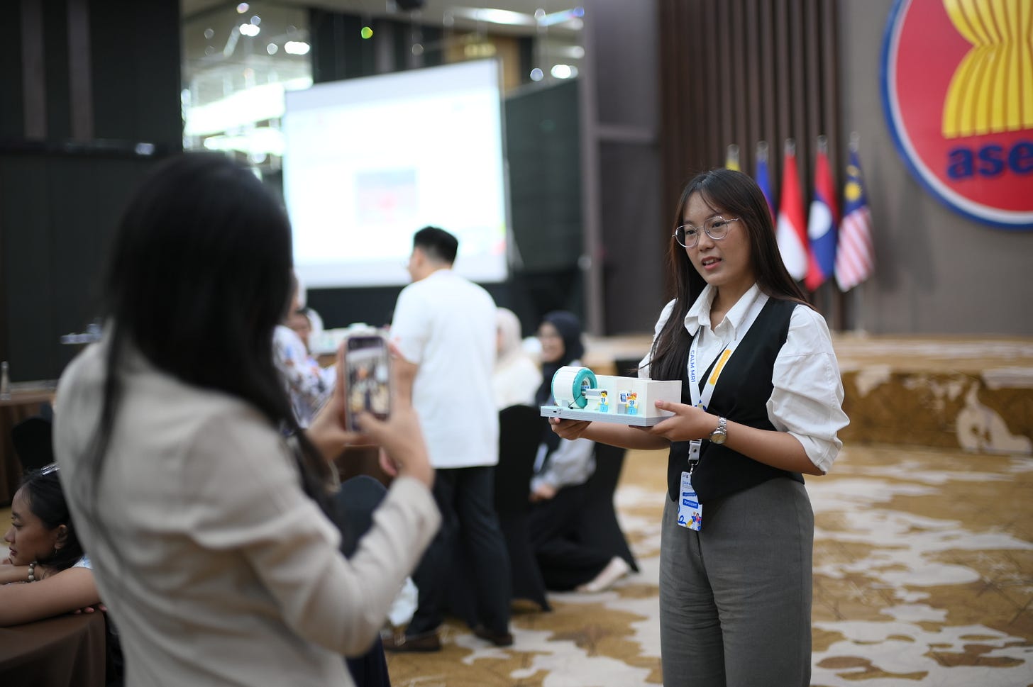 a girl holding lego mri scanner at a asean foundation event inside the asean secretariat building a girl holding lego mri scanner at a asean foundation event inside the asean secretariat building