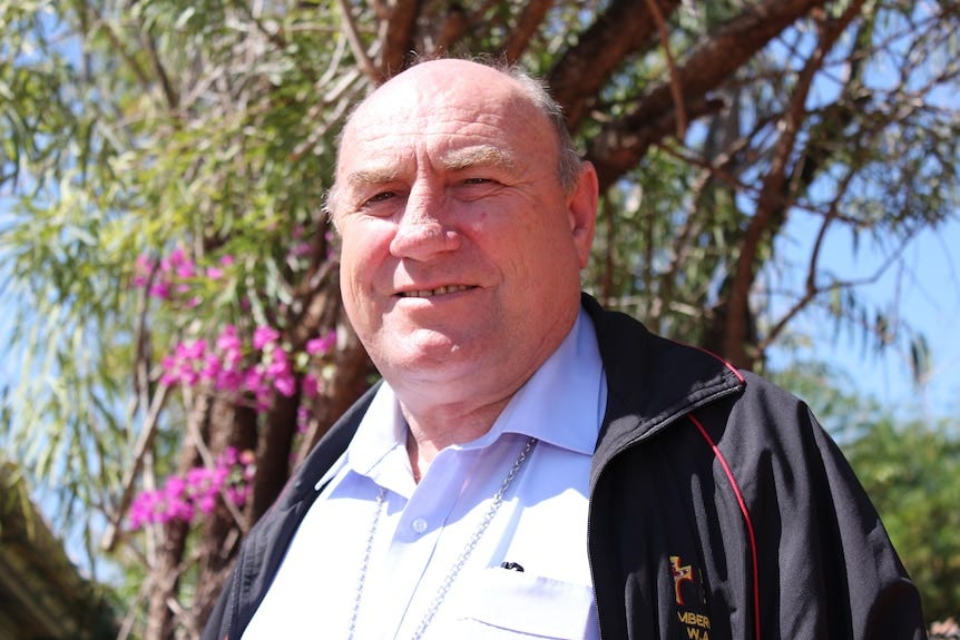 Broome Bishop Christopher Saunders close up in front of a tree.