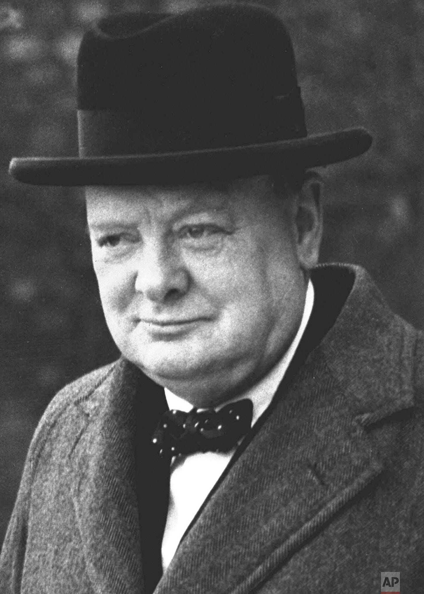 Winston Churchill, pictured in London on March 28, 1940, rallied the British nation to confront Adolf Hitler and German forces sweeping across Europe during a pivotal moment in World War II.