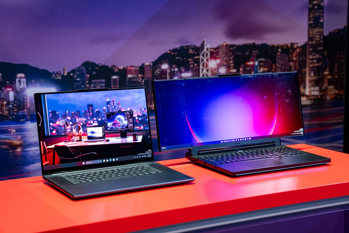 The Lenovo Legion Pro Rollable laptop next to a conventional 16-inch laptop.
