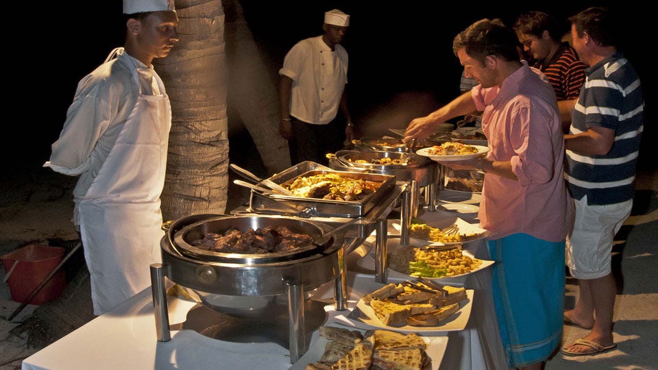 White Hat Chef Overlooking the Buffet Line