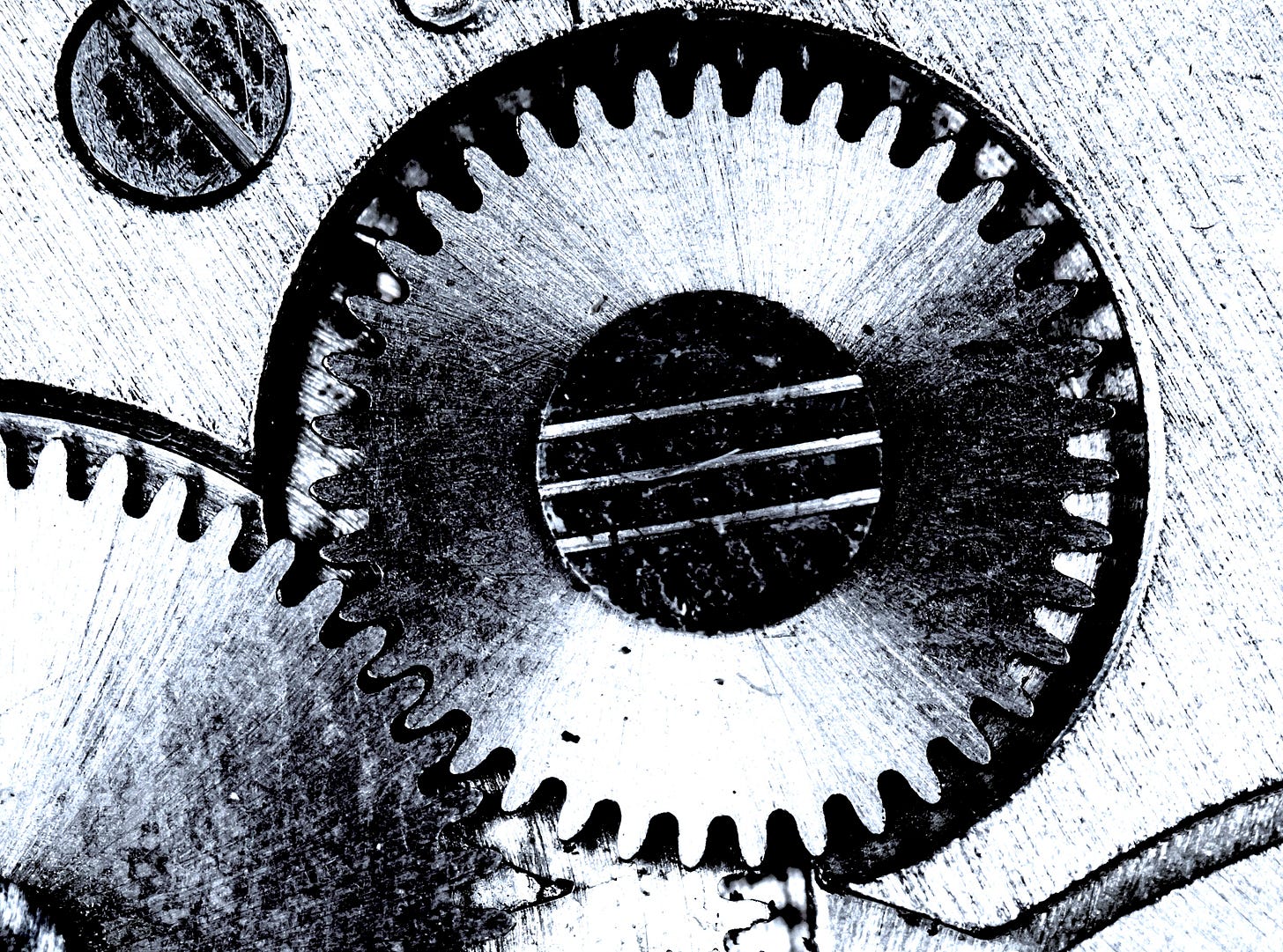 Close-up of three interlocking metal gears, symbolizing the systems and leverage behind the three moves to $50K. Close-up of three interlocking metal gears, symbolizing the systems and leverage behind the three moves to $50K.