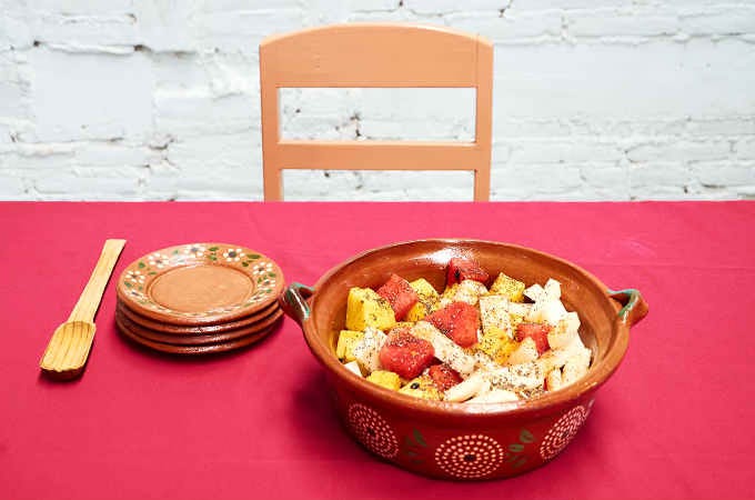 spicy Mexican fruit salad in serving bowl