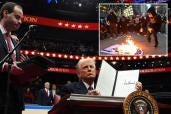 Donald Trump seated at a podium with a book, Ernő Mesterházy standing behind him
