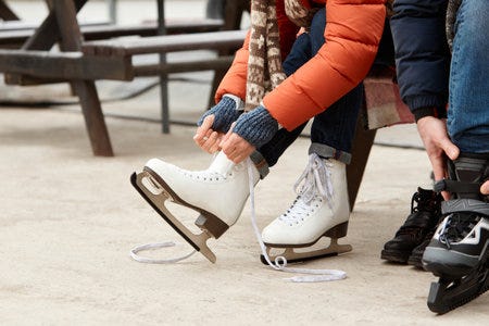 Cropped Image Of Woman Tying Laces On Skates, Preparing To Skate On Rink.  Favourite Winter Hobby And Activity. Outdoor Arena Stock Photo, Picture and  Royalty Free Image. Image 198423873.