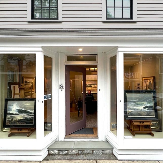 A store front with art in the windows

Description automatically generated