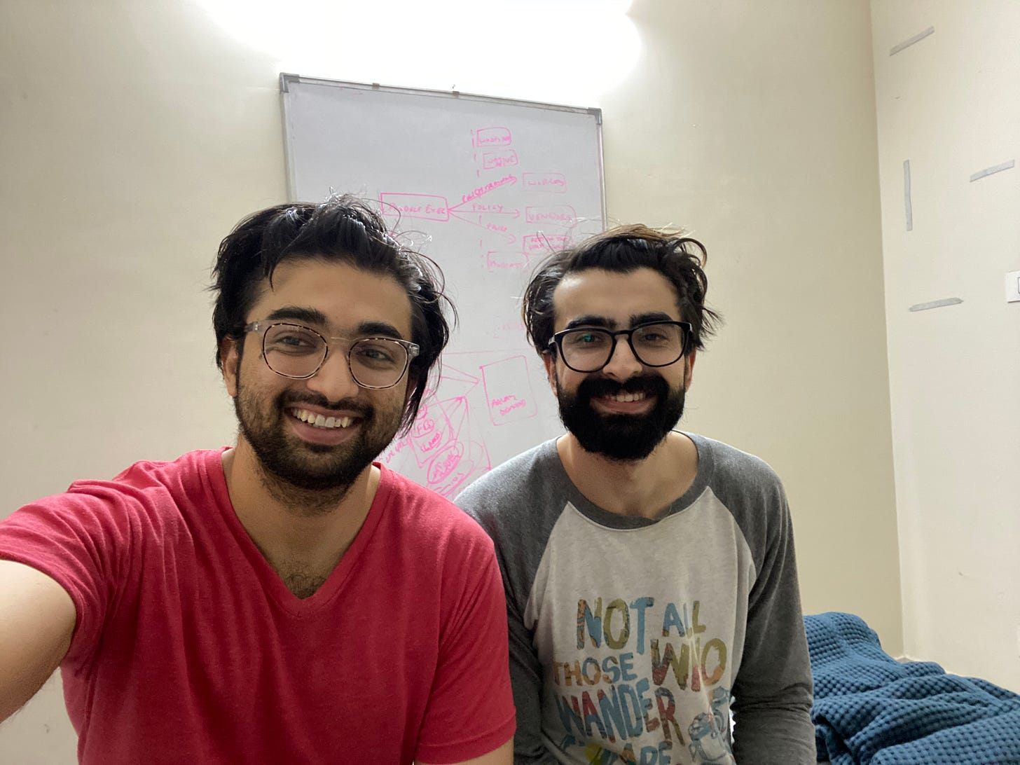 The two brothers smiling for a selfie