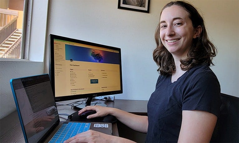 Maya Gosztyla at her desk on a computer and using the Notion app. Maya Gosztyla at her desk on a computer and using the Notion app.