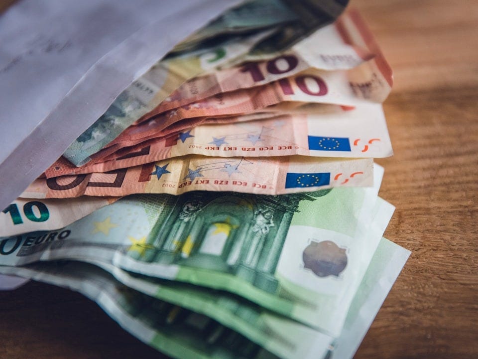 euro banknote collection on wooden surface euro banknote collection on wooden surface