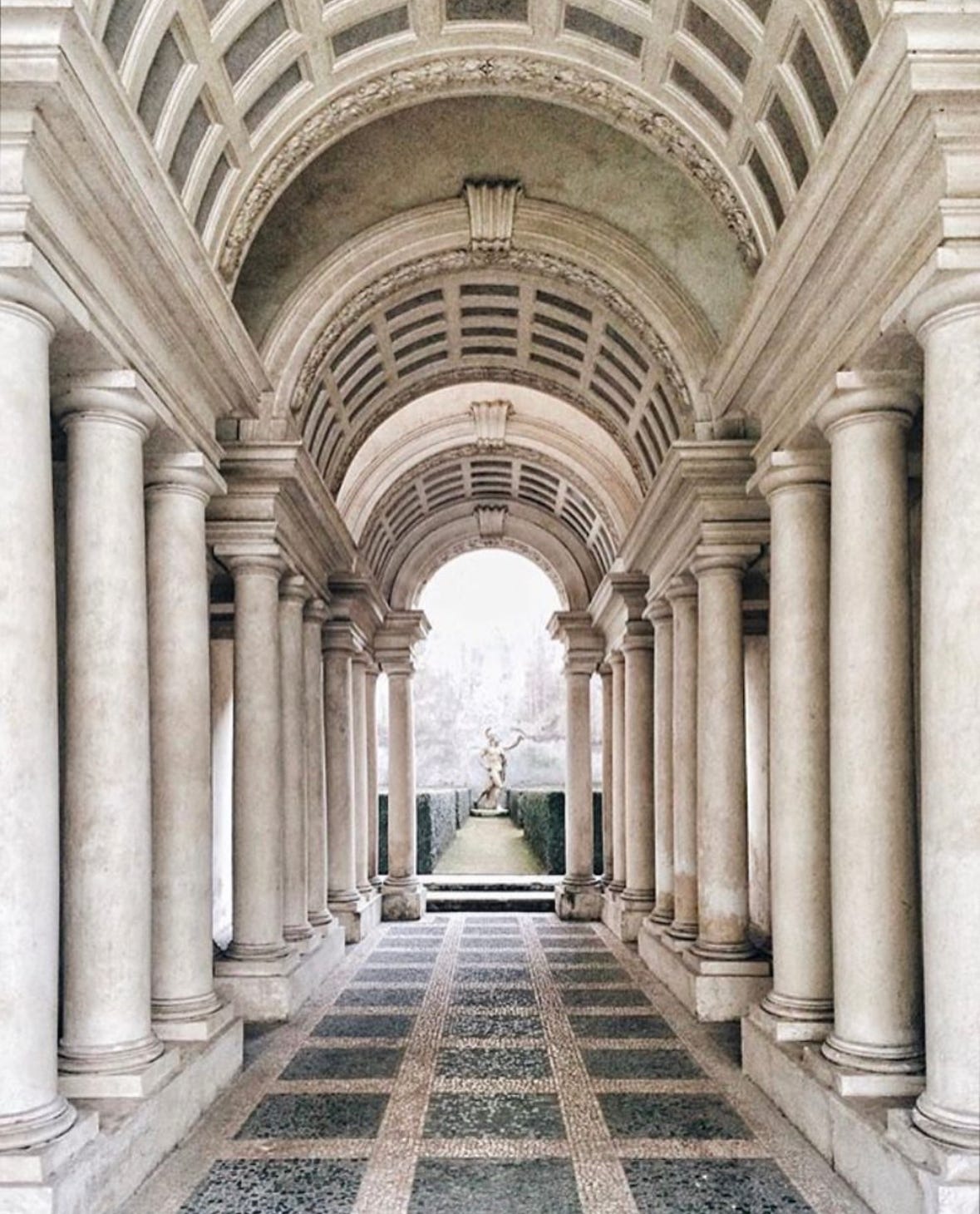 columns and a statue in Rome