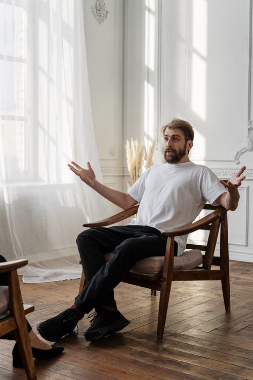 Man talking to psychologist, a job that will be in demand in 2025