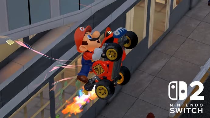Mario Kart World's photo mode showing Mario riding a kart in mid-air, with the Switch 2 logo in the corner