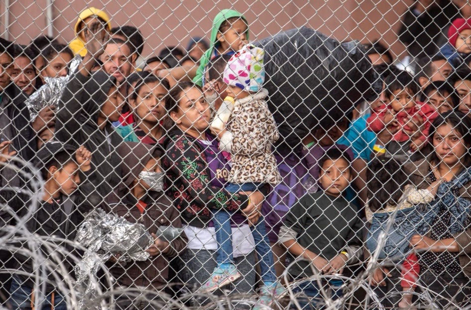 A group of people standing behind a fence

AI-generated content may be incorrect.