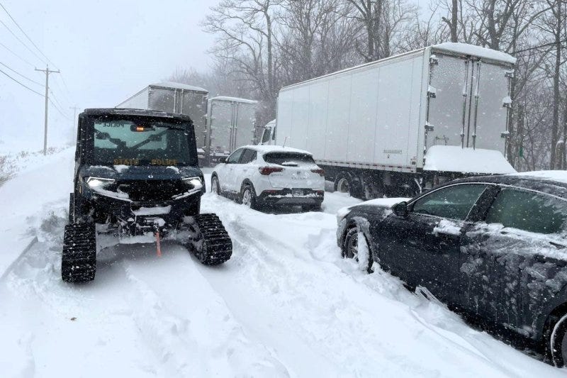 Cars and trucks are stranded along State Route 5 in Portland, N.Y., on Saturday as the region was inundated by up to 4 feet of lake effect snow. Heavy snow in the Great Lakes and bitter cold in the Midwest and Southeast were the rule over the holiday weekend. Photo courtesy New York State Police/Facebook